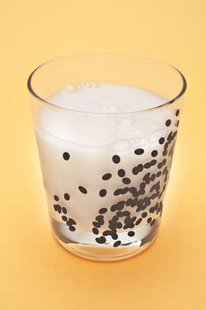 Tasty Fresh Glass of Milk on a Yellow Background.の写真素材