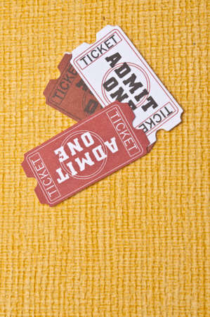 Lets Go to the Movies! Generic movie tickets on a vibrant yellow background.の写真素材