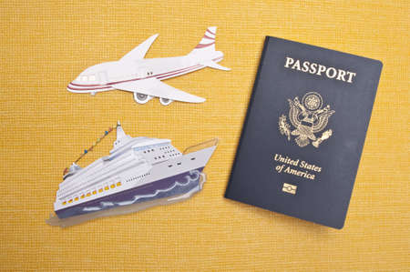 Cruise Ship, Airplane and American Passport on a Vibrant Yellow Background for a Travel Concept Image.の写真素材