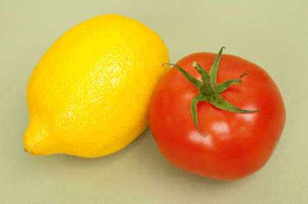 Lemon and Tomato on a Soft Green Background.の写真素材