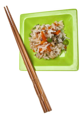 Snack of Chicken Fried Rice on a Green Plate with Chopsticks Isolated on White の写真素材