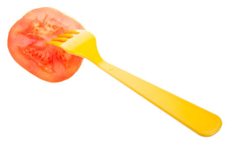 Fresh Tomato with a Fork for a Tasty Snack.  Isolated on White の写真素材