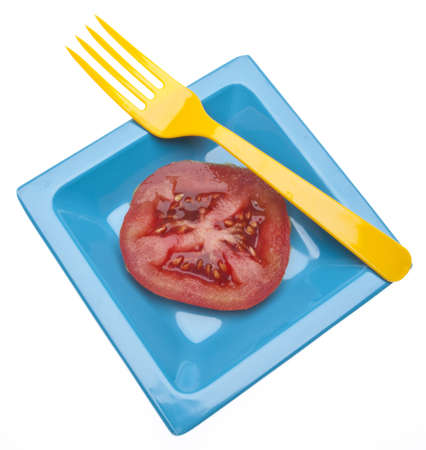 Fresh Tomato with a Fork for a Tasty Snack.  Isolated on White の写真素材