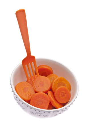 Carrots in a Bowl with a Vibrant Orange Forkの写真素材