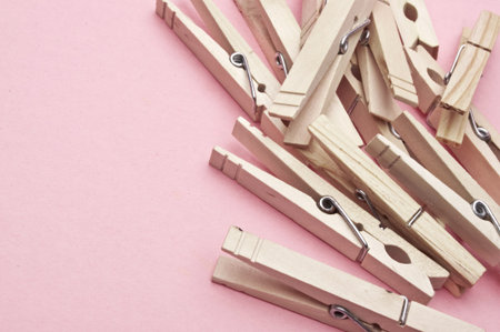 Modern Laundry Scene with Clothespins on a Pink Background.の写真素材