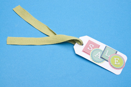 Vibrant Sale Tag on a Bright Blue Background with Copy Space.