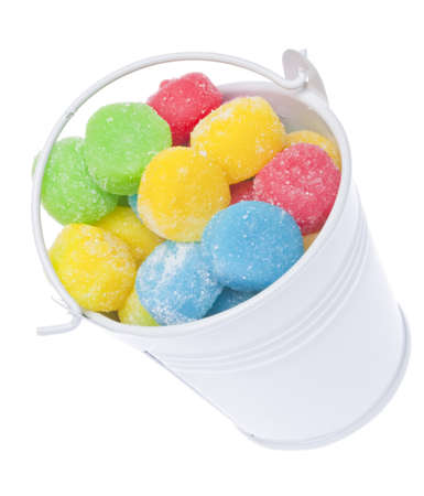Bucket Full of Bright Gum Drop Candies on White.の写真素材