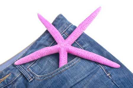 Vibrant Pink Starfish in the Pocket of Denim Blue Jean Pants Summer Vacation Conceptの写真素材