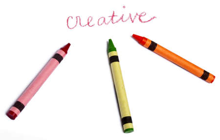 The Word Creative Handwritten with Several Vibrant colored Crayons on White.の写真素材