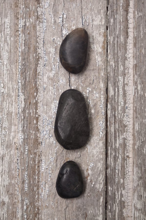 Zen Massage Stones on Rustic Wood.  Age and Serenity.の写真素材