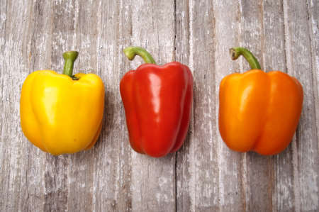 Vibrant Peppers on Rustic Wood Autumn Still Lifeの写真素材