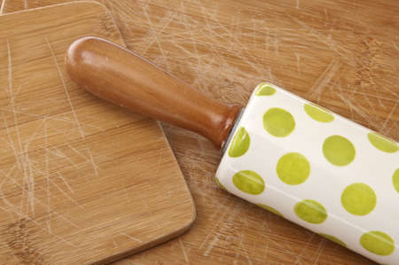Kitchen Background Image Featuring Wooden Cutting Boards with Scratches and a Spotted Rolling Pin for Baking.の写真素材