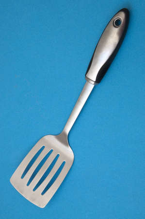 Metal Spatula on Modern Blue Kitchen Concept.の写真素材