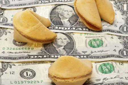 Money and Fortune Concept with American Dollars and Fortune Cookies.の写真素材
