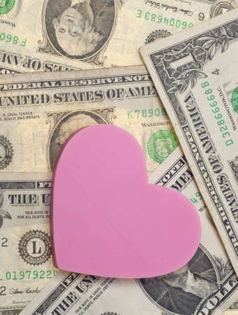 Love and Money Conceptual Image with a Heart and American Currency.の写真素材