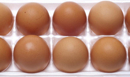 Close Up of Brown Eggs in the Carton Food Concept.