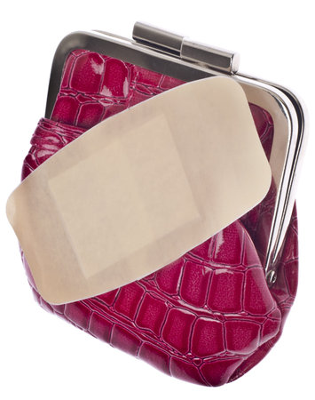 Budget Concept Image with Bandage on a Trendy Pink Wallet 
