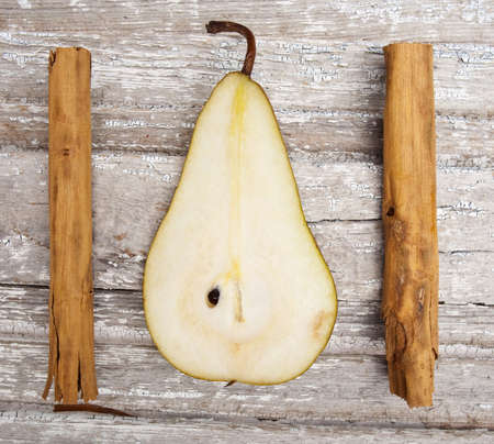 Pear Slice with Cinnamon on Vintage Wood Holiday Concept Image.の写真素材