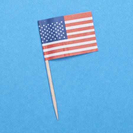 American Flag Toothpick on a Blue Background.  Everyday Object.の写真素材