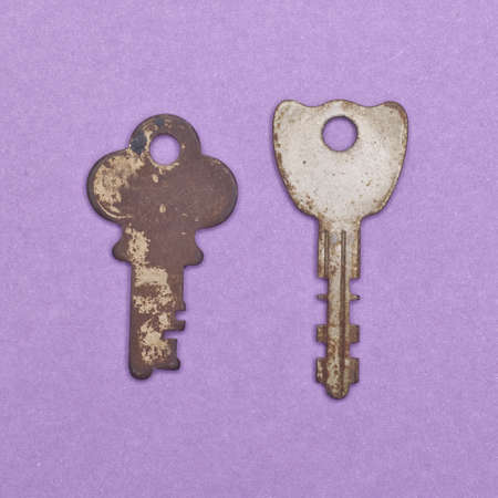 Set of Vintage Keys on a Purple Background.  Everyday Object.の写真素材