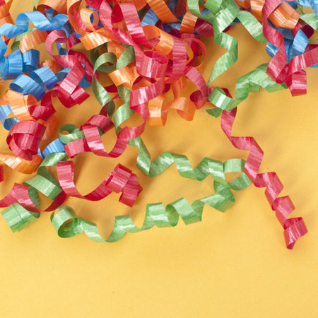 Party Ribbon on a Vibrant Orange Background.