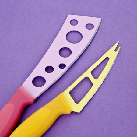 Set of Modern Kitchen Knives on a Vibrant Purple Background.