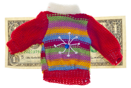 American Currency and Striped Winter Sweater Concept for Cost of Holiday Gift Shopping.