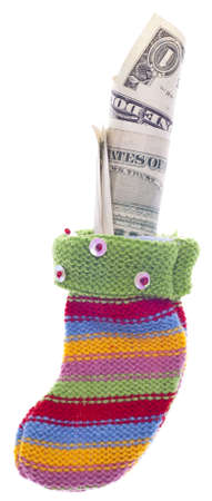 Holiday Stocking Sock Filled with American Dollar Currency.  Isolated on White の写真素材