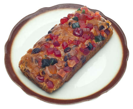 Holiday Fruit Cake on a Dish Isolated on White の写真素材