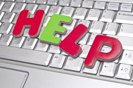 HELP Office Concept with Word Help on Laptop Keyboard.