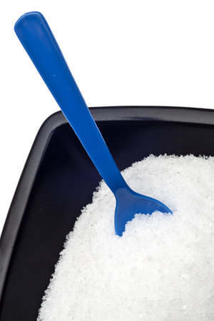 Epsom Salt in a Black Bowl with Vibrant Blue Spoon.の写真素材