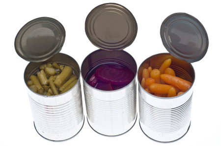 Variety of Canned Vegetables in Cans Including Asparagus, Carrots and Beets Isolated on White.の写真素材