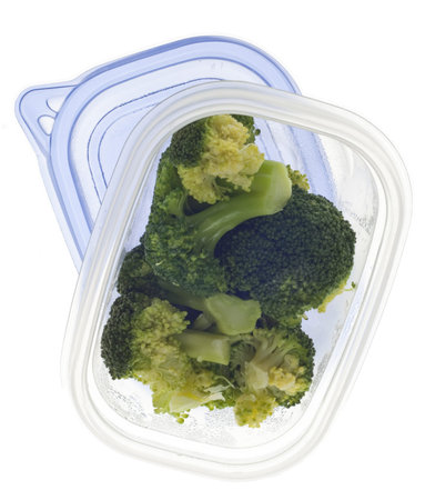Leftover Broccoli in a Plastic Container on White.の写真素材
