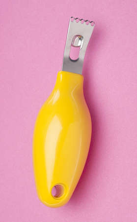 Lemon Zester on a Vibrant Pink Background.の写真素材