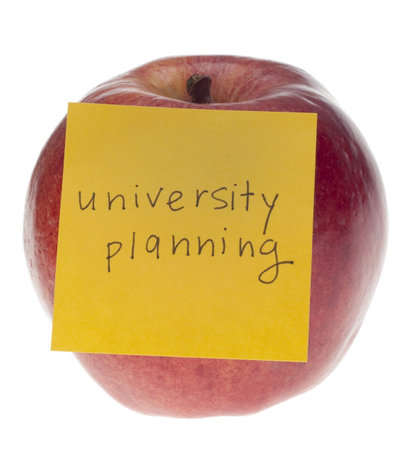 University Planning Concept with Apple and Sticky Note Isolated on White の写真素材