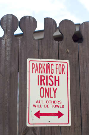 Parking for Irish Only Sign on an Old Fence.の写真素材
