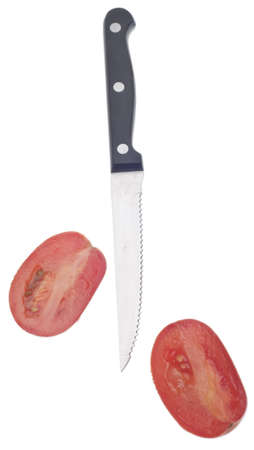 Sliced Roma Tomato with Knife Isolated on White の写真素材