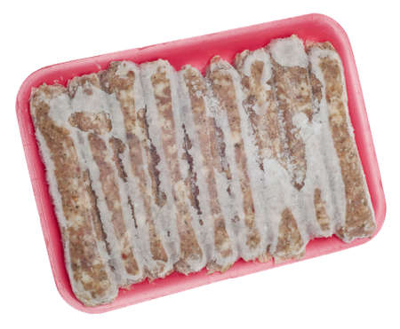 Frozen Pork Sausage Links with Frost Isolated on Whiteの写真素材