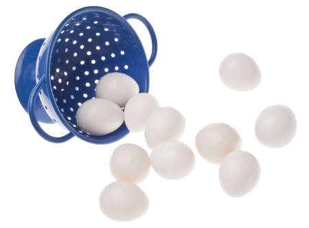 Colander with Hard Boiled Quail Eggs Isolated on White.の写真素材