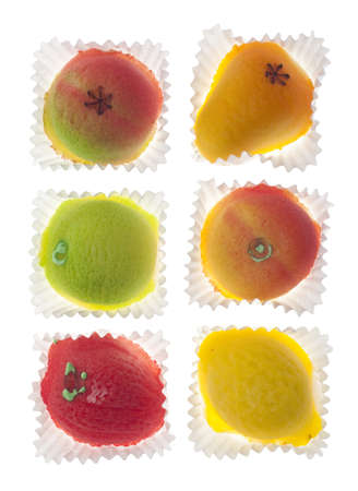 Colorful Marzipan in Fruit Shapes in Wrappers Isolated on の写真素材