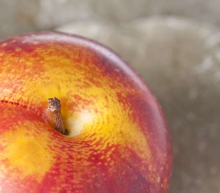 Nectarine Detail with Selective Focus on Rock Background.の写真素材