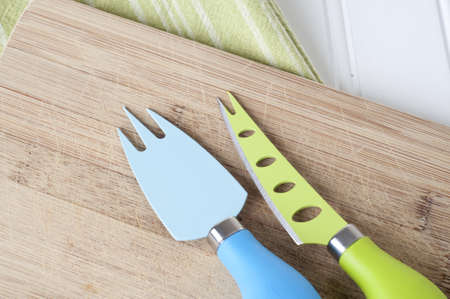 Knife and Fork on Chopping Block Kitchen Background Image.の写真素材