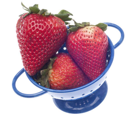 Fresh Strawberries in a Colander Isolated on White with a Clipping Path.の写真素材