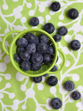Fresh Modern Blueberries in a Vibrant Green Colander 
