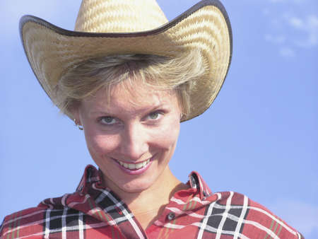 Girl in cowboy hat smilingの写真素材