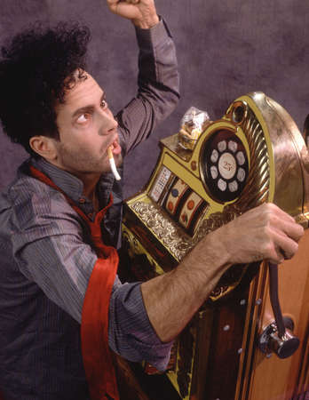 Gambler at slot machineの写真素材