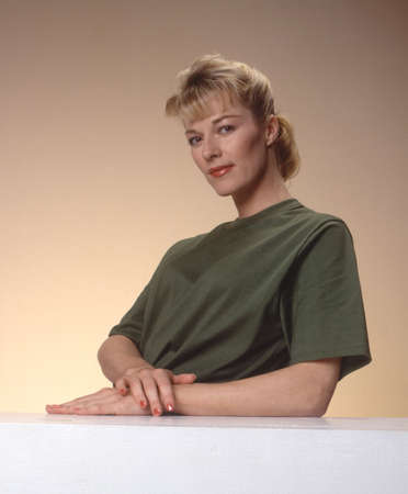 Woman looking content with tee shirtの写真素材