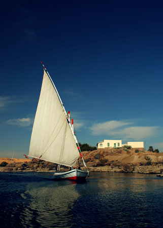 A traditional felucca on the river Nile at Aswan, Egypt.の写真素材