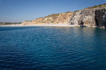 Stunning Beach and Rock Formations of Rhodes: A sea-level view of the island's diverse coastline,...