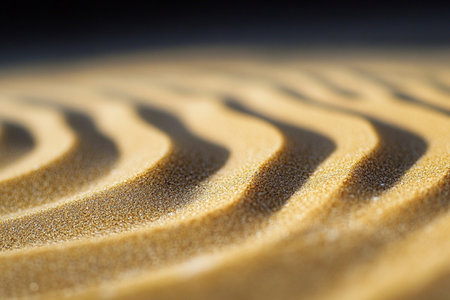 Close up of sand waves in a zen garden at sunset.の素材